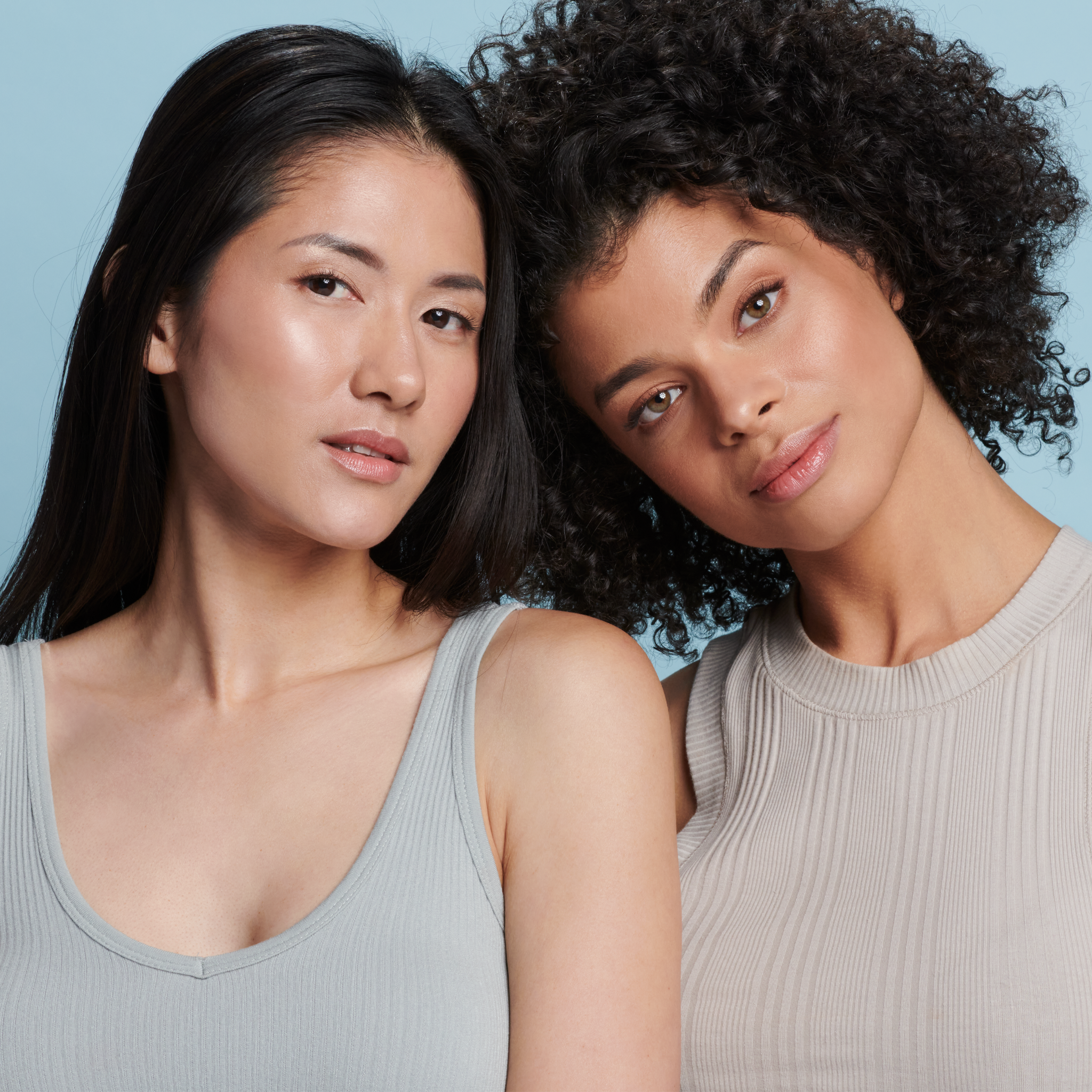Two women, one with fair and one with tan skin tone wearing Sunforgettable® Total Protection™ Face Shield Classic SPF 50 || all